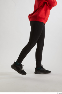 Selin  1 black leggings black sneakers dressed flexing leg…